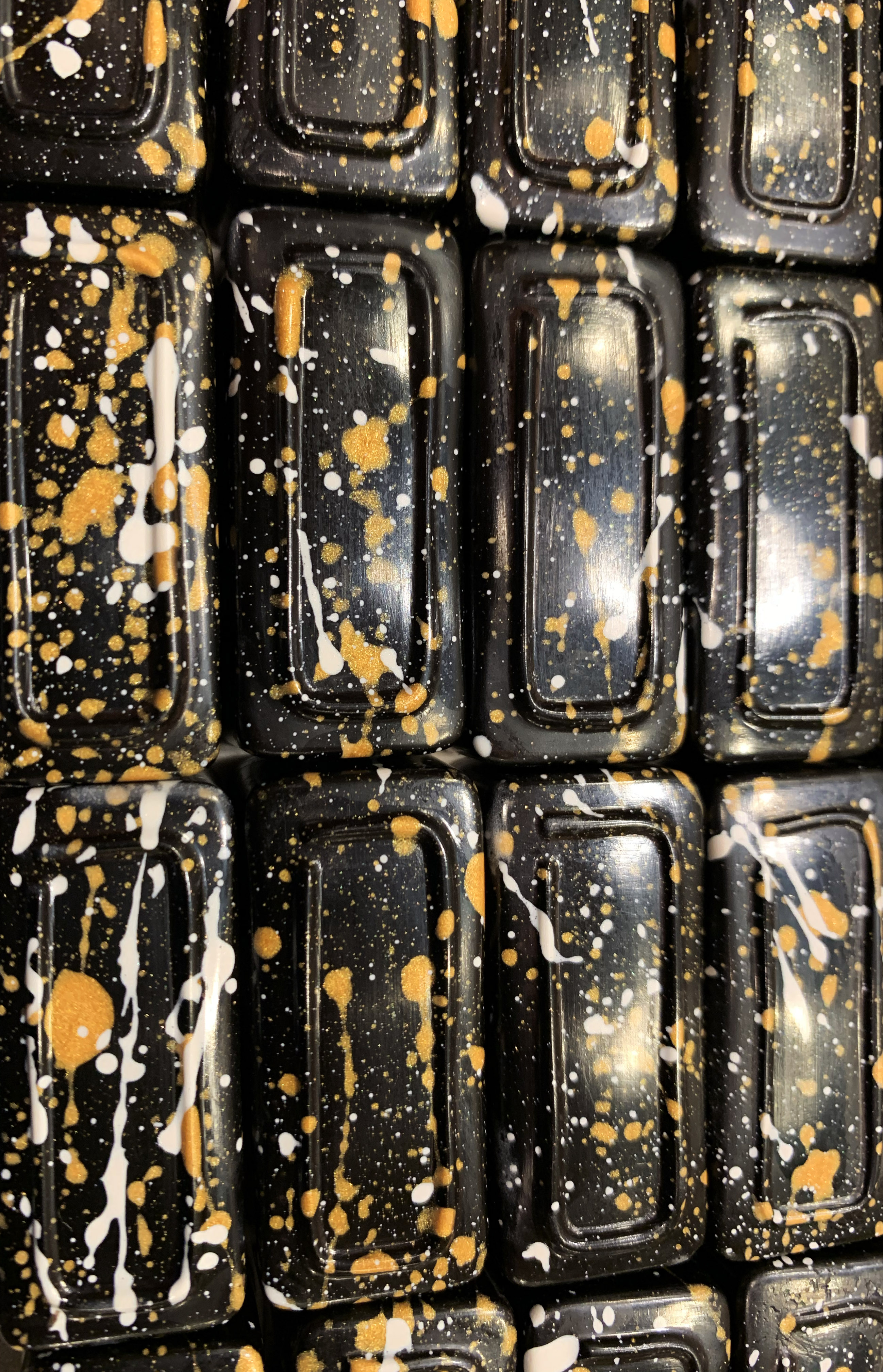 gold-white-spatter chocolate bars